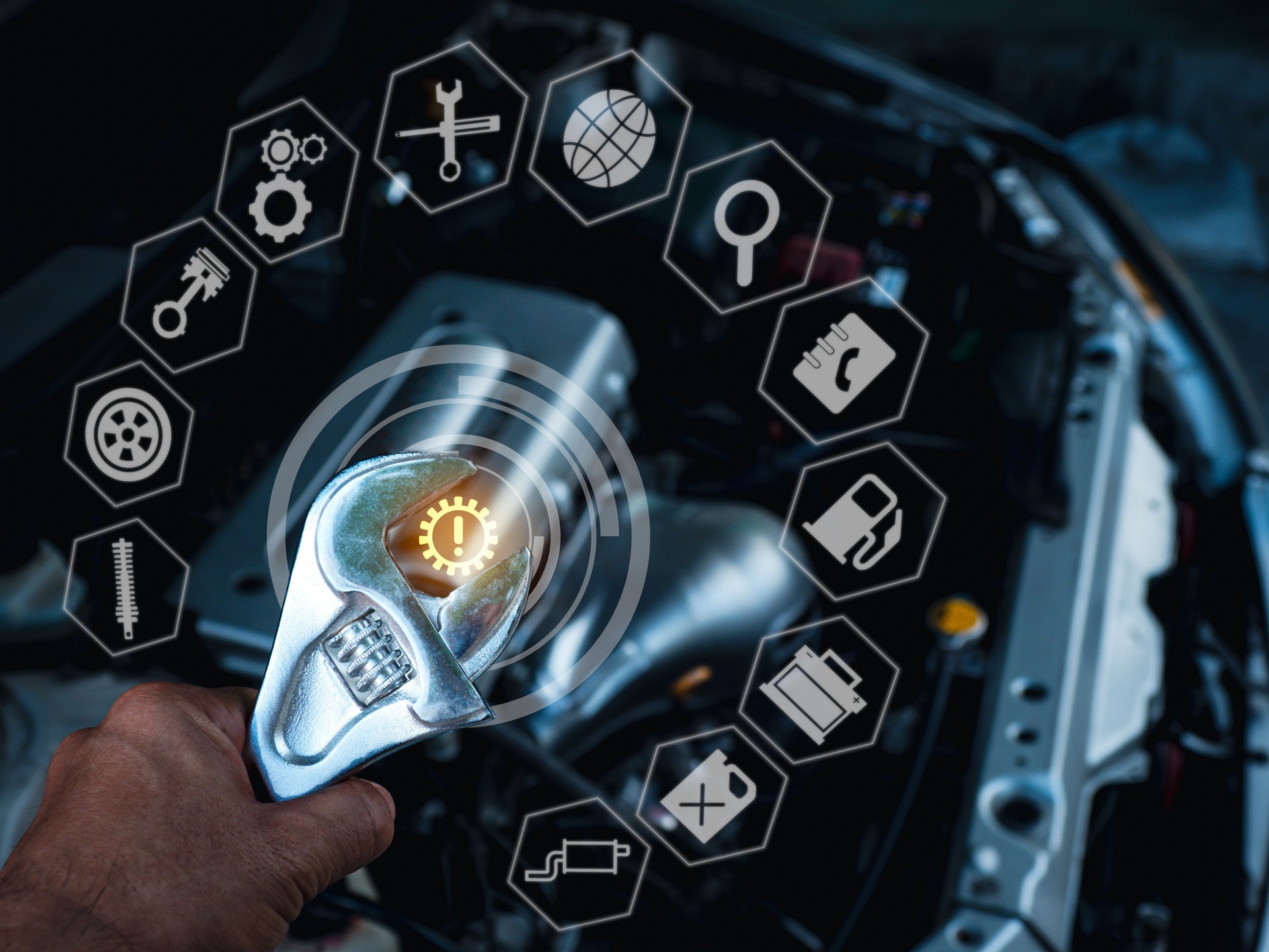 A man's hand holds a large wrench with his left hand above the engine compartment where the bonnet is opened. And there is a glowing white icon all around